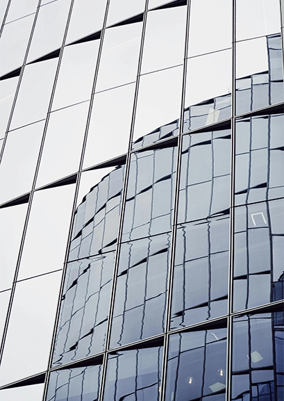 Window film and tint solutions on a glass building in Auckland